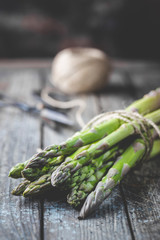 Bunch of fresh asparagus on wooden table