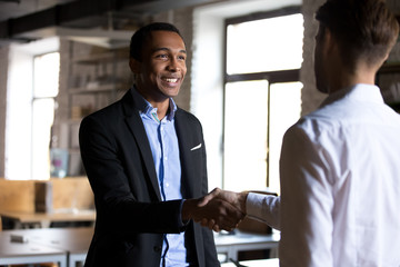 Boss shaking hands greeting new employee or company client