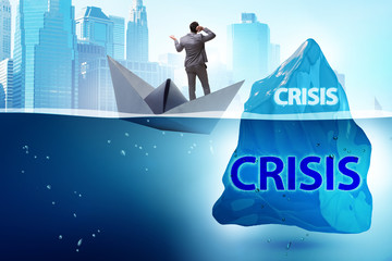 Crisis concept with businessman on iceberg