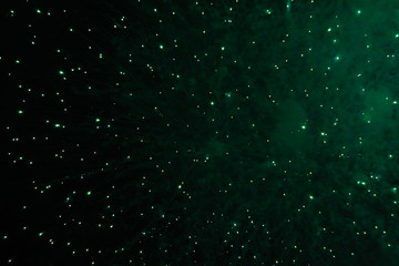 nflorescence of bright dark green firework lights. Halloween, Christmas, Independence Day, New Year.