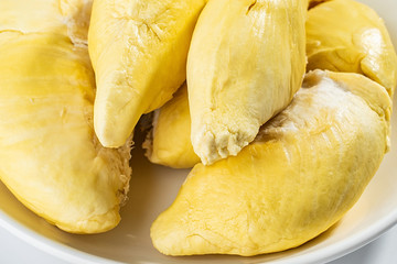 A dish of fresh ripe yellow delicious durian flesh