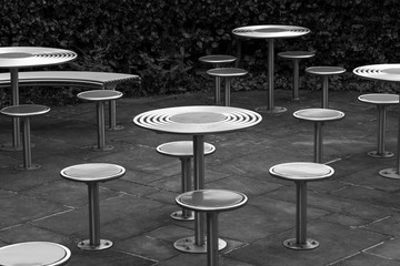 Round stainless steel outdoor seats and tables