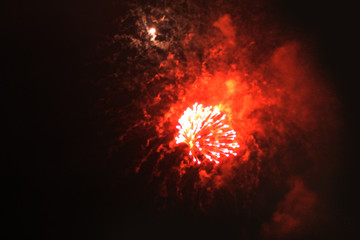 A beautiful flash of bright gold and red shiny firework lights. during Halloween, Christmas,...