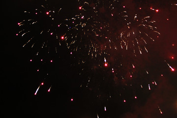 A beautiful placer of bright red sparkling sparks of fireworks during Halloween, Christmas,...