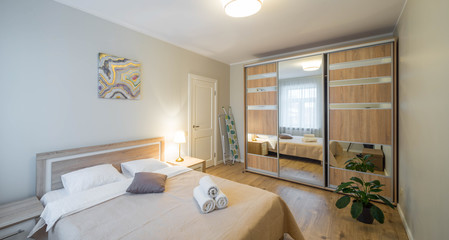 Modern bedroom with furniture.