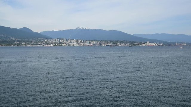 A seaplane is touching down to the sea. Burrard Inlet Vancouver BC Canada            4  