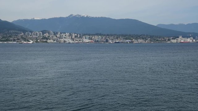 A seaplane is touching down to the sea. Burrard Inlet Vancouver BC Canada      3