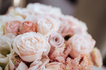 Wedding flowers, bridal bouquet closeup. Decoration made of roses, peonies and decorative plants, close-up, selective focus, nobody, objects