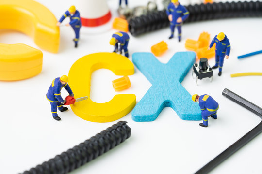 CX, Customer Experience Concept, Miniature Figure Worker Building Alphabet CX At The Center, Important Of Customer Centric Experience Design In Recent World Business, Product And Service