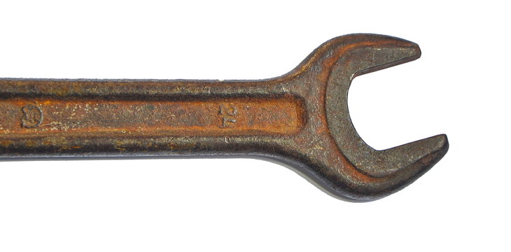 old rusty wrench isolated on white background