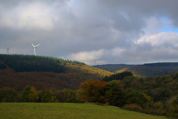 Languedoc, France: The sun rays make their way through the dark clouds and illuminate the red...