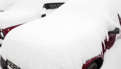 Cars in the snowdrift on the parking lot