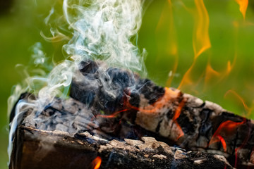 Burning firewood in the fire outdoor