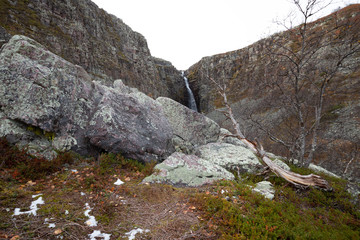 Mounitain with waterfall in the background in a national park in sweden photographed in late autumn