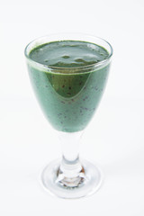 Banana and blueberry smoothie with spirulina in a glass