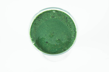 Banana and blueberry smoothie with spirulina in a glass