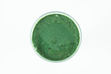Banana and blueberry smoothie with spirulina in a glass