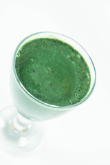 Banana and blueberry smoothie with spirulina in a glass