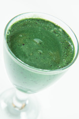 Banana and blueberry smoothie with spirulina in a glass