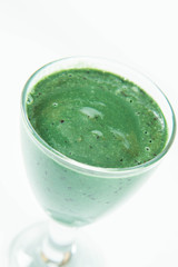 Banana and blueberry smoothie with spirulina in a glass