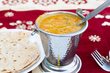 Indian popular food Dal fry or traditional Dal Tadka Curry served with indian bread