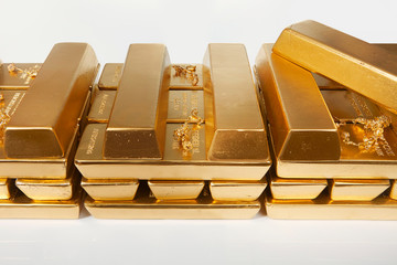 Hundreds kilos of illegal gold bullions on background