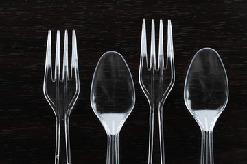 transparent plastic fork and spoon for food eating garbage issue for environmental pollution