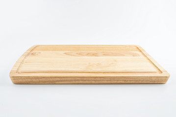 a wooden chopping board on a white background