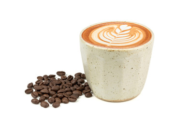 Side view of Hot latte coffee with latte art in a vintage cup and roasted coffee beans isolated on white background. (Image stacking technique)