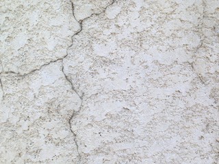 vintage concrete wall with cracks, painted white, background stock texture