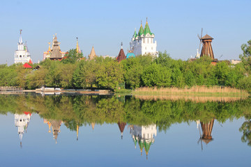 Kremlin in Izmailovo in Moscow Russia early spring morning with reflection in the blue water of the pond