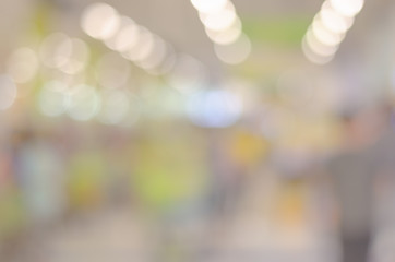 abstract blur bokeh background indoor in the shopping mall with many people.
