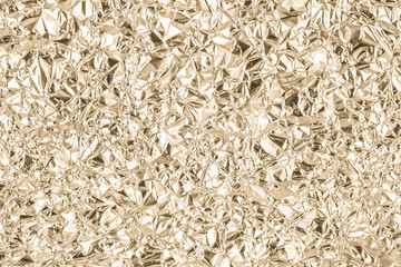 Gold wrinkled paper texture abstract background