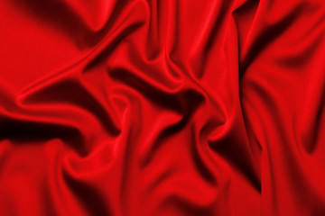 Obraz premium The texture of the satin fabric of red color for the background