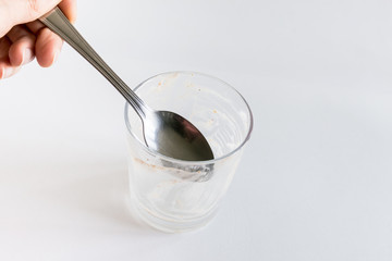 Glass empty, after a delicious dessert, isolated on white background