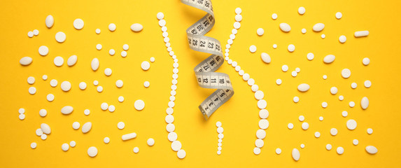 Slimming with pills, fat burner. Weight loss concept, slim your body without exertion. Vitamin drugs.