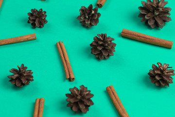 pine cones, cinnamon, and New Year decor isolated on the blue background, Preparation for Christmas