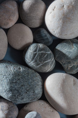 stones from holidays, the sea. top view photo, pile of grey and black stones