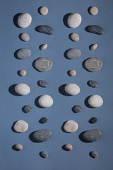 ground stones isolated on the blue background, top view photo
