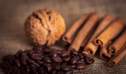coffee beans and cinnamon are on the table