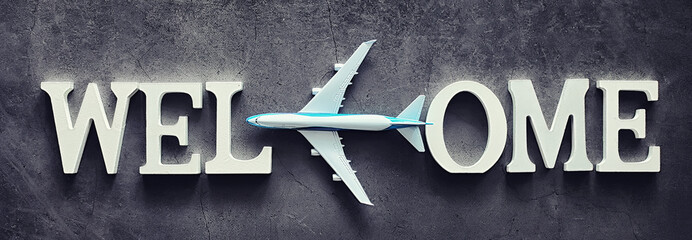 Background concept. Inscription Welcome on a dark background.