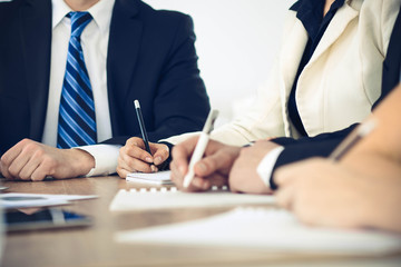 Group of business people or lawyers  at meeting, hands close-up