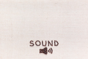 Small megaphone below the word Sound all made from coffee beans, aligned bottom.