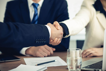Business people shaking hands at meeting or negotiation in the office. Handshake concept. Partners are satisfied because signing contract