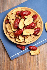Red jujube slices in wooden plate