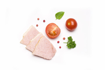 slices of pork and sliced tomato and next parsley and red pepper peas