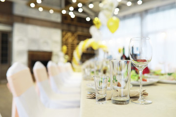 Glasses on the table in the restaurant. Table setting.
