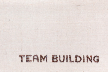 The words Team Building written with coffee beans,aligned at the bottom.