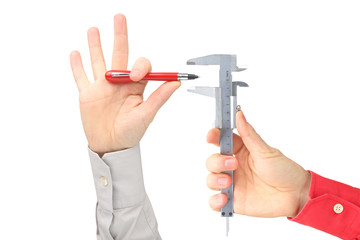 two hands with writing pen and measuring instrument on white background