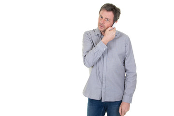 handsome man listening on a phone on a white background